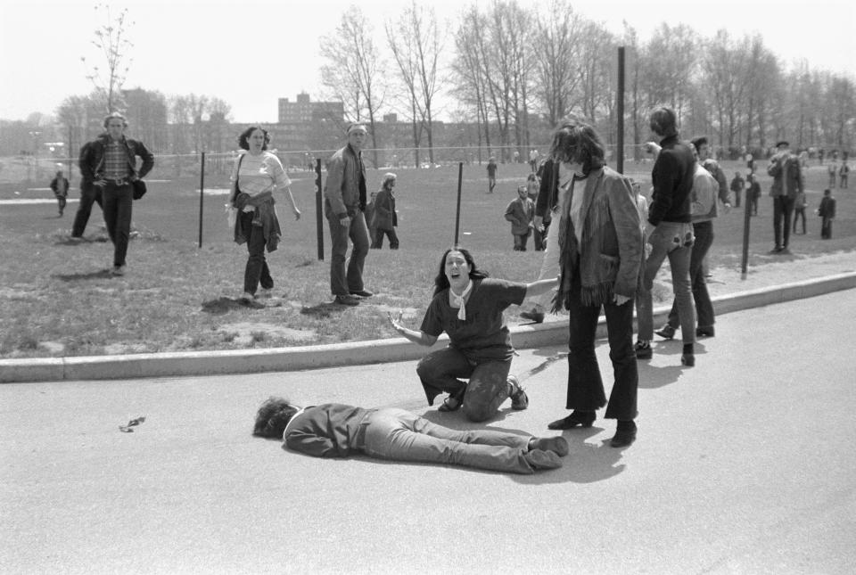 Mary Ann Vecchio screams as she kneels over the body of Kent State University student Jeffrey Miller on May 4, 1970. A cropped version of this image won the Pulitzer Prize.