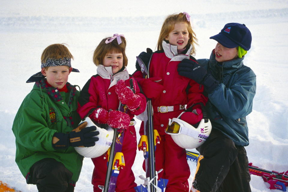 KLOSTERS, SWITZERLAND - JANUARY 03:  Klosters, Switzerland --- Prince William Helping His Cousin Princess Beatrice With The Collar Of Her Ski Suit As They Pose With Prince Harry And Princess Eugenie For A Photocall During Their Skiing Holiday.  (Photo by Tim Graham Photo Library via Getty Images)