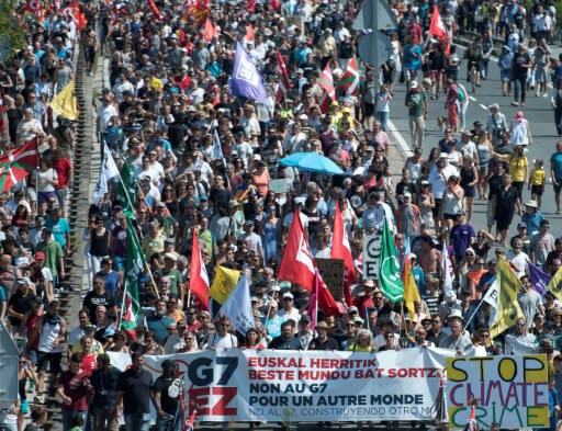 The colourful crowd was an eclectic mix of environmental activists, families, anti-globalists, a handful of anti-government "yellow vest" protesters and Basque nationalists