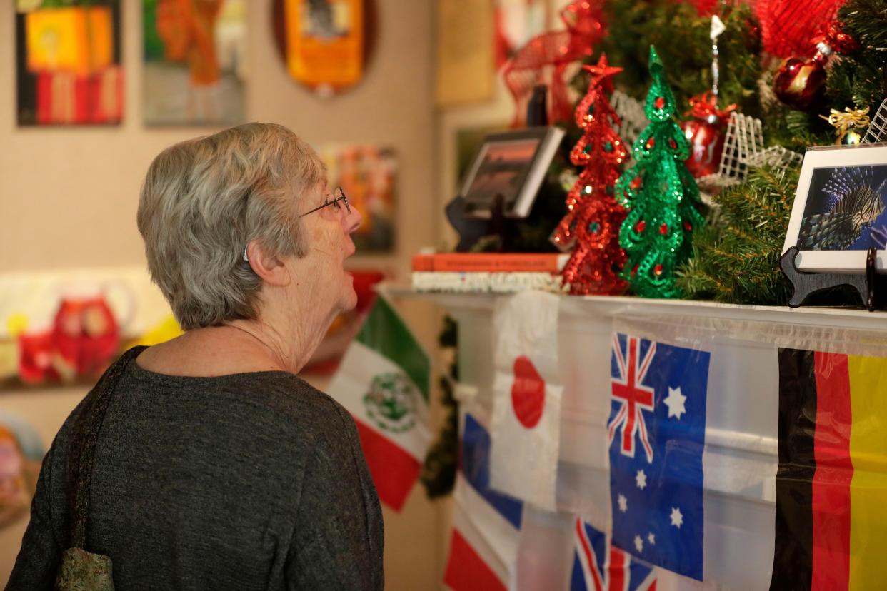 Rochelle Davis looks at Christmas decorations as she enjoys the LeMoyne Arts Annual Holiday Show. This year's Diamond Jubilee show marks LeMoyne's 60th year and opens Nov. 18, 2023.