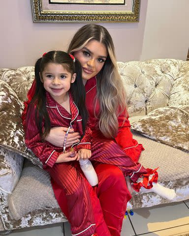 <p>Doniya Malik Instagram</p> Doniya Malik with her niece Zaneyah, Safaa's daughter, on Christmas in 2023.