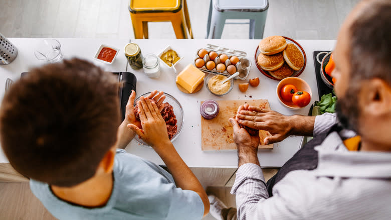 People forming burger patties