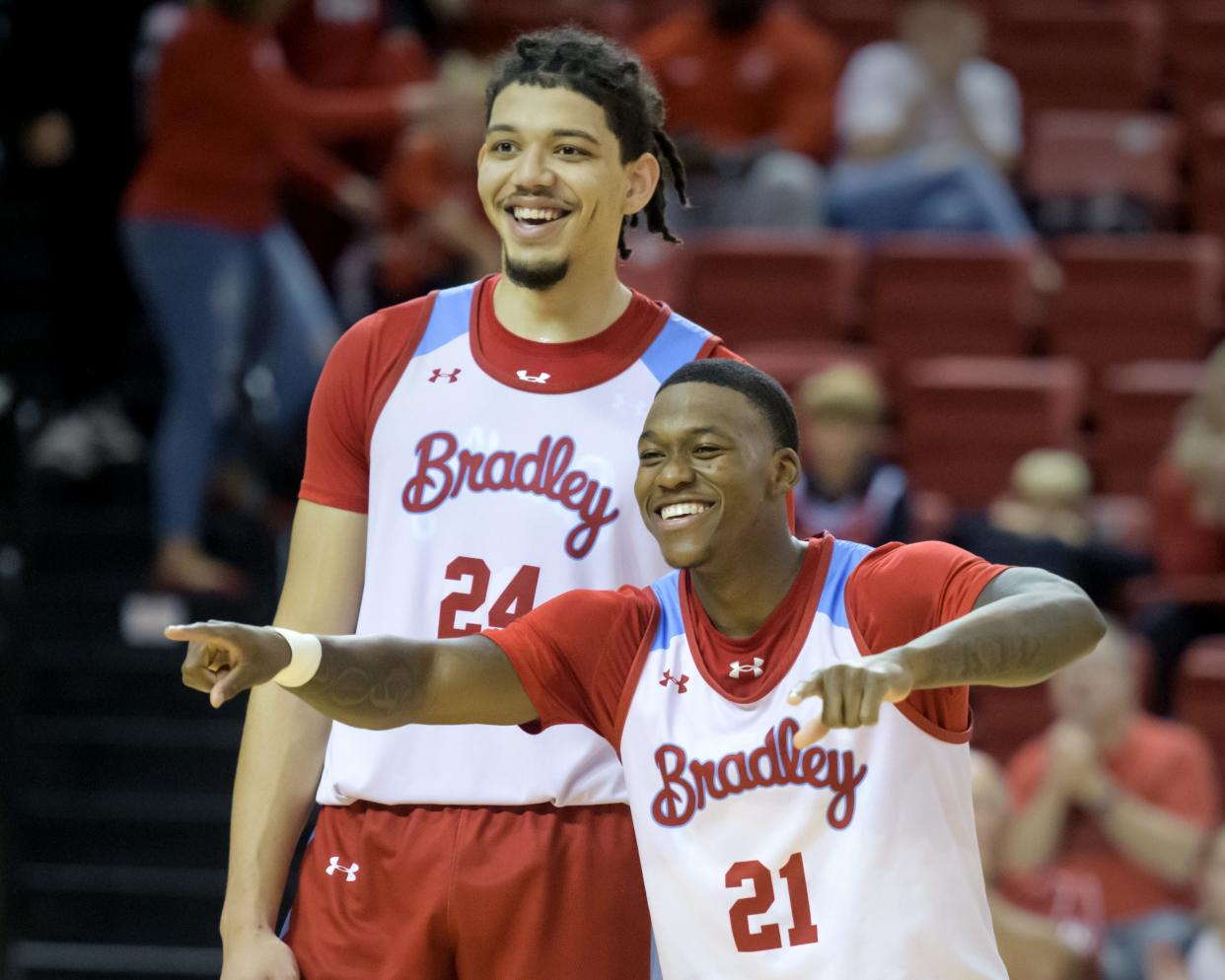 Bradley's Duke Deen (21) and Kyle Thomas laugh with their teammates during player introductions for the annual Red-White Scrimmage on Saturday, Oct. 21, 2023 at Renaissance Coliseum.