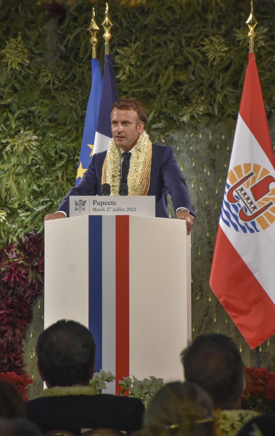 France's President Emmanuel Macron wearing a flower lei and seashell necklaces delivers a speech after a meeting with the President of the French Polynesia Edouard Fritch in Tahiti, French Polynesia in the Pacific Ocean, Tuesday, 27, 2021.President Emmanuel Macron reasserted France's presence in the Pacific on a visit to French Polynesia aimed in part at countering growing Chinese dominance in the region. (AP Photo/Esther Cuneo)