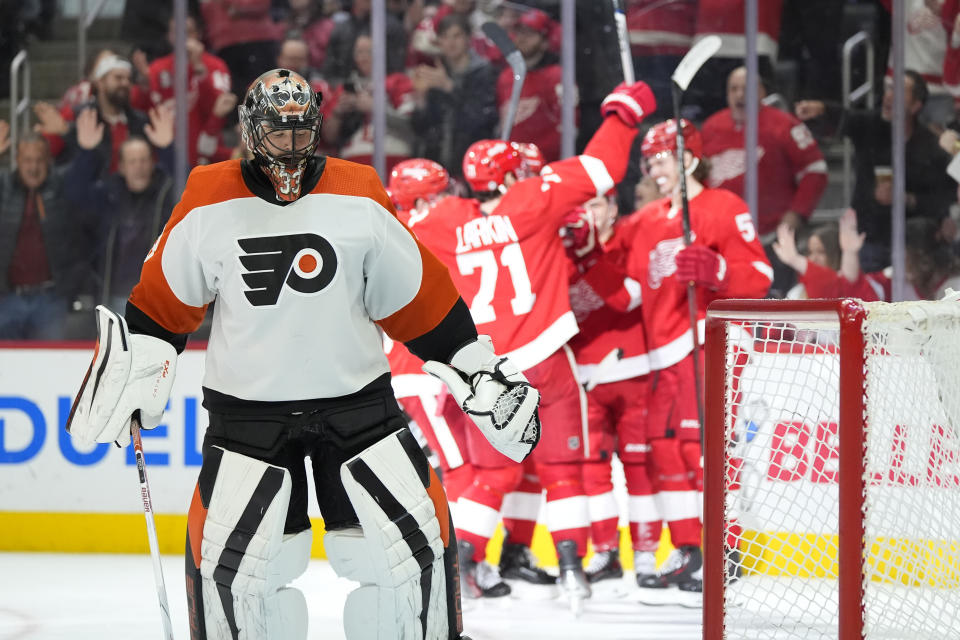 Philadelphia Flyers goaltender Samuel Ersson skates next to the net as the Detroit Red Wings celebrate a goal during the second period of an NHL hockey game, Thursday, Jan. 25, 2024, in Detroit. (AP Photo/Carlos Osorio)