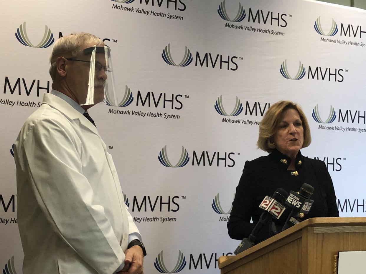 Dr. Kent Hall, chief physician executive of the Mohawk Valley Health System, seen in this 2020 O-D file photo with MVHS President/CEO Darlene Stromstad, modeled a face shield made by health system staff to prevent transmission of COVID-19. Hall, who is retiring at the end of the month, served as the health system's medical spokesman during the COVID-19 pandemic.
