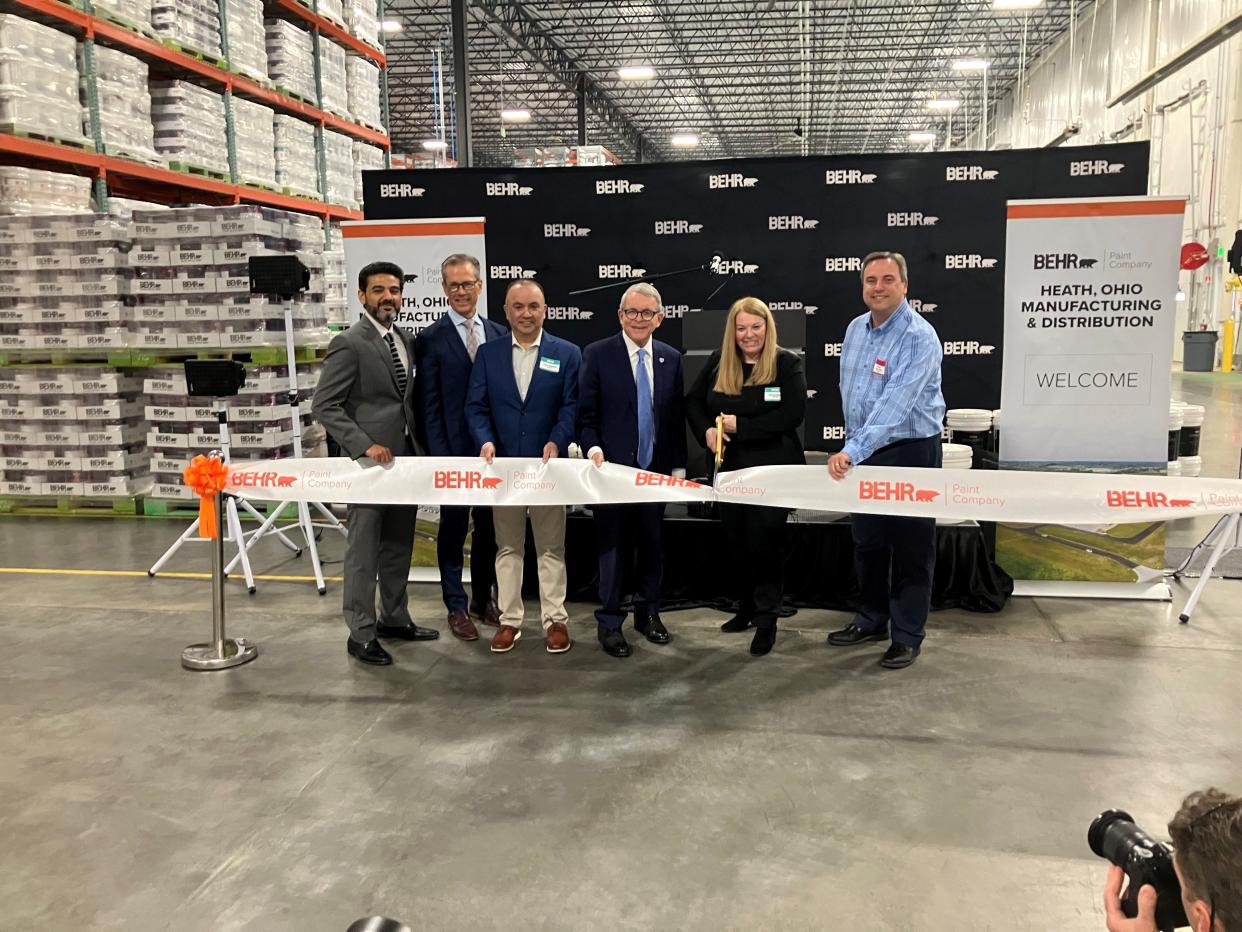 Gov. Mike DeWine, Heath Mayor Mark Johns and officials from Behr Paint and parent company Masco cut a ribbon Tuesday on the 300,000-square-foot Behr Paint manufacturing and distribution facility at the Central Ohio Aerospace and Technology Center campus in Heath.