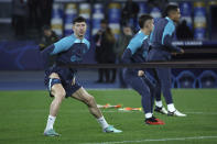 Barcelona's Robert Lewandowski, left, attends a training session in Naples, Italy, Feb. 20, 2024. FC Barcelona will face SSC Napoli for a Champions League, round of sixteen first leg, soccer match on Wednesday, Feb. 21, 2024. (Alessandro Garofalo/LaPresse via AP)