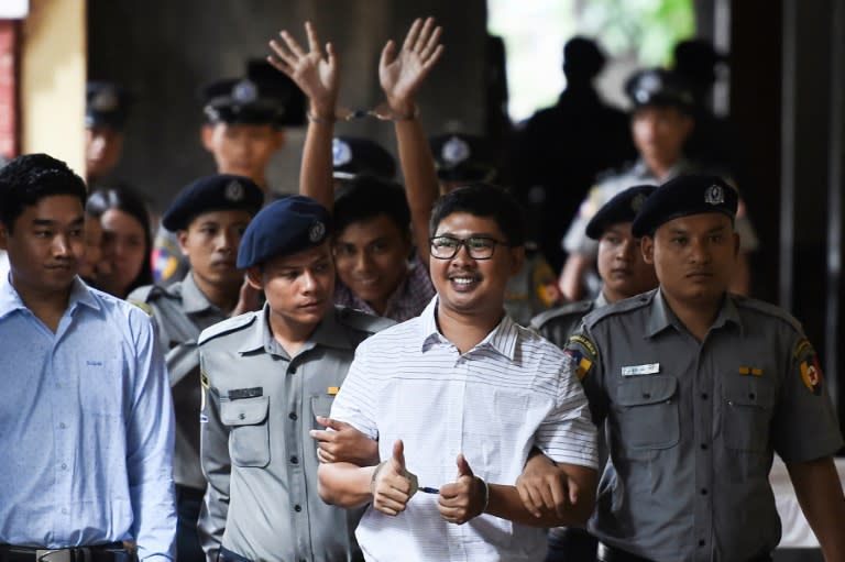 UN chief Antonio Guterres said it was "not acceptable" for Reuters journalists Wa Lone (front) and Kyaw Soe Oo (C-back) to be jailed in Myanmar for doing their jobs