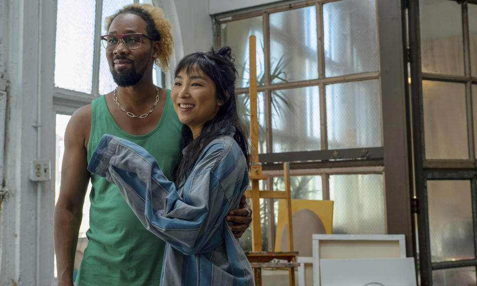 This image released by A24 Films shows RZA, left, and Greta Lee in a scene from "Problemista." (Jon Pack/A24 via AP)