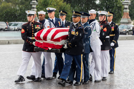 Joint service members of a military casket team carry the casket of Senator John McCain into the US Capitol, where he will lie in state for the rest of the day in Washington, DC, USA, 31 August 2018. McCain died 25 August, 2018 from brain cancer at his ranch in Sedona, Arizona, USA. He was a veteran of the Vietnam War, served two terms in the US House of Representatives, and was elected to five terms in the US Senate. McCain also ran for president twice, and was the Republican nominee in 2008. JIM LO SCALZO/POOL Via REUTERS