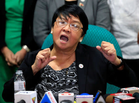 Judy Taguiwalo, a left-wing activist who was jailed during the 1970s martial law era of late dictator Ferdinand Marcos, gestures during a news conference after Philippine lawmakers rejected the appointment of her as social welfare minister during a Commission on Appointment hearing at the Senate headquarters in Pasay City, Metro Manila, Philippines August 16, 2017. REUTERS/Romeo Ranoco