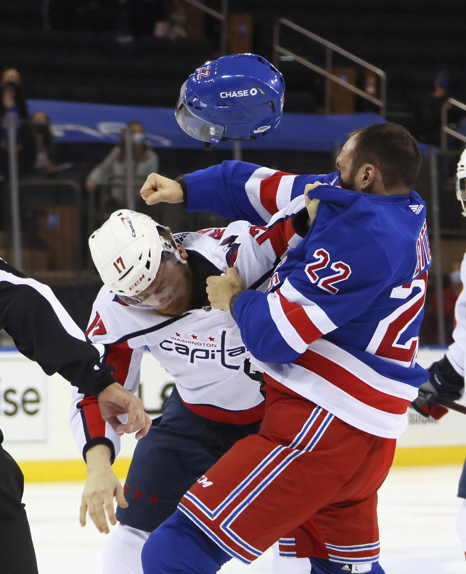 New York Rangers' Anthony Bitetto (22) and Washington Capitals' Michael Raffl (17) fight during the first period of an NHL hockey game Wednesday, May 5, 2021, in New York. (Bruce Bennett/Pool Photo via AP)