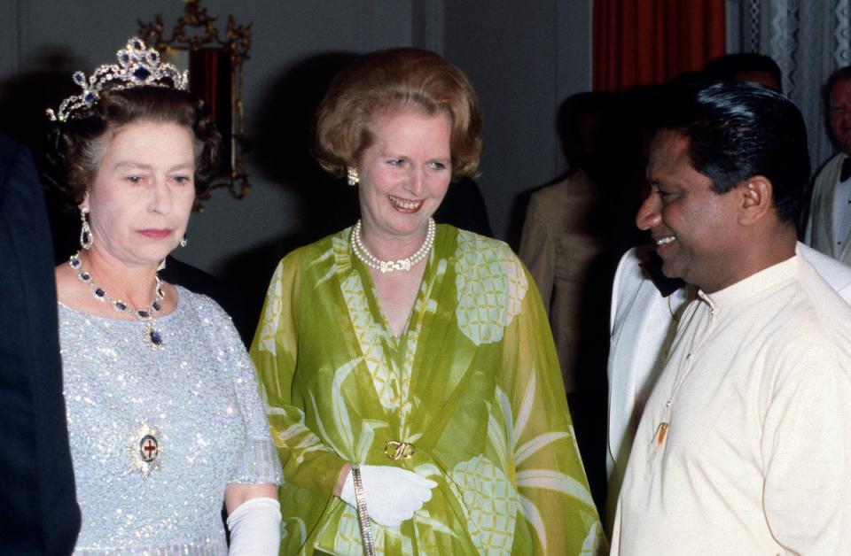 Queen Elizabeth II and Prime Minister Margaret Thatcher attend a ball to celebrate the Commonwealth Heads of Government Meeting hosted by President Kenneth Kaunda on August 1, 1979 (Getty Images)