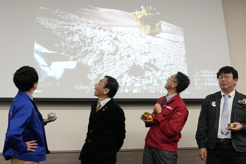 From left, JAXA's Daichi Hirano, Hitoshi Kuninaka, from the Institute for Space and Astronautical Science (ISAS), Shinichiro Sakai, SLIM project manager, and Masatsugu Otsuki