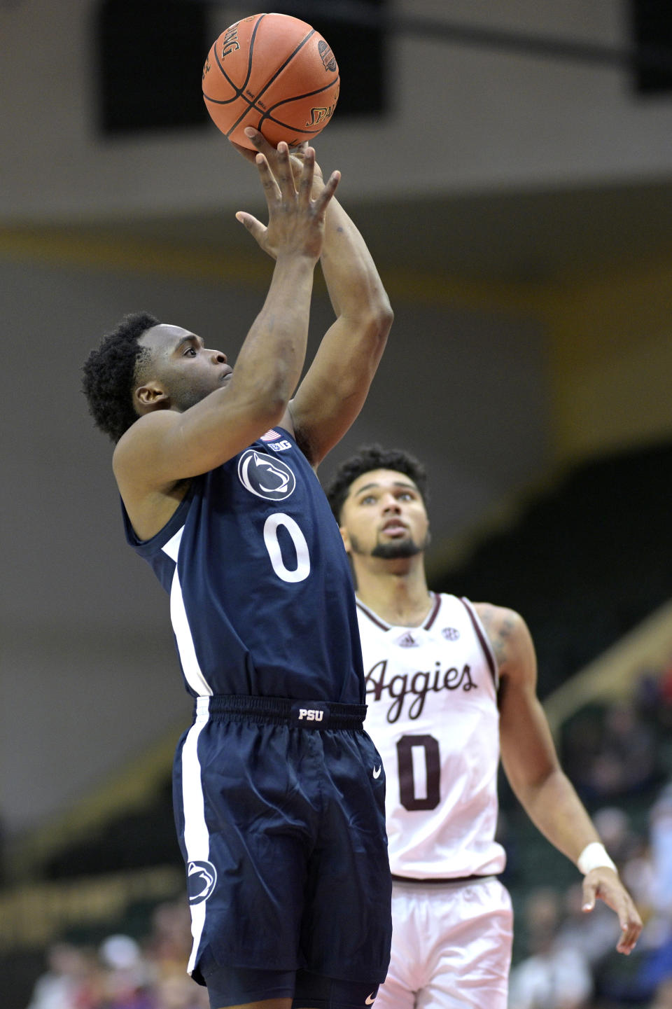 Penn State guard Kanye Clary (0) shoots in front of Texas A&M guard Jace Carter during the first half of an NCAA college basketball game, Thursday, Nov. 23, 2023, in Kissimmee, Fla. (AP Photo/Phelan M. Ebenhack)