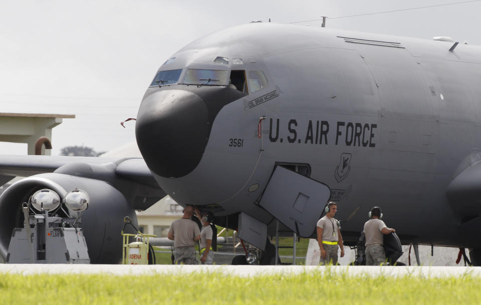 In this Aug. 14, 2012 photo, ground crew members work on a U.S. Air Force KC-135 Stratotanker at Kadena Air Base on Japan's southwestern island of Okinawa. The most recent of the KC-135 refueling tankers currently in service started flying in 1964. For decades, the U.S. Air Force has grown accustomed to such superlatives as unrivaled and unbeatable. Now some of its key aircraft are being described with terms like decrepit. (AP Photo/Greg Baker)