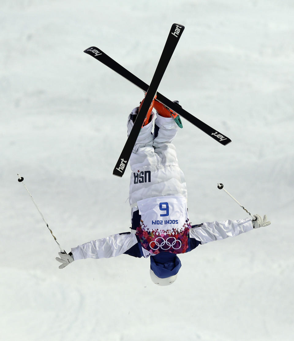 Bradley Wilson of the United States jumps during the men's moguls qualifying at the Rosa Khutor Extreme Park at the 2014 Winter Olympics, Monday, Feb. 10, 2014, in Krasnaya Polyana, Russia. (AP Photo/Andy Wong)
