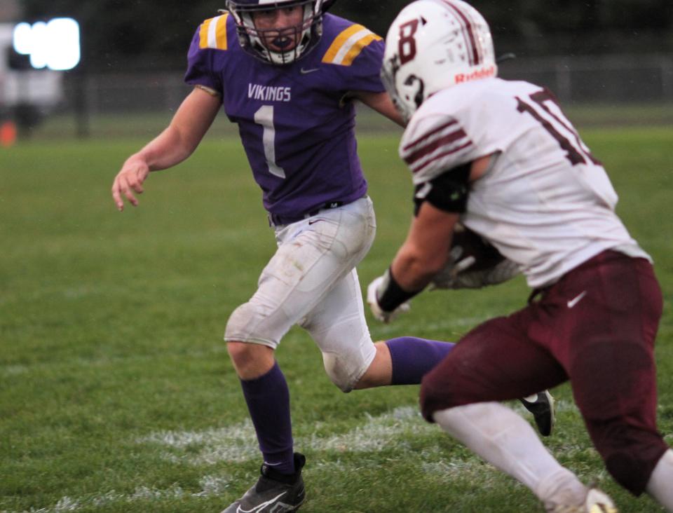 Bronson's Collin York looks to make a tackle on Buchanan's Nico Finn on Thursday.