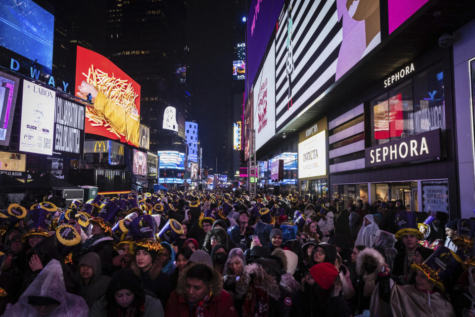 Revelers celebrate in Times Square as they attend the New Year's Eve celebrations on Saturday, Dec. 31, 2022 in New York. (AP Photo/Stefan Jeremiah)