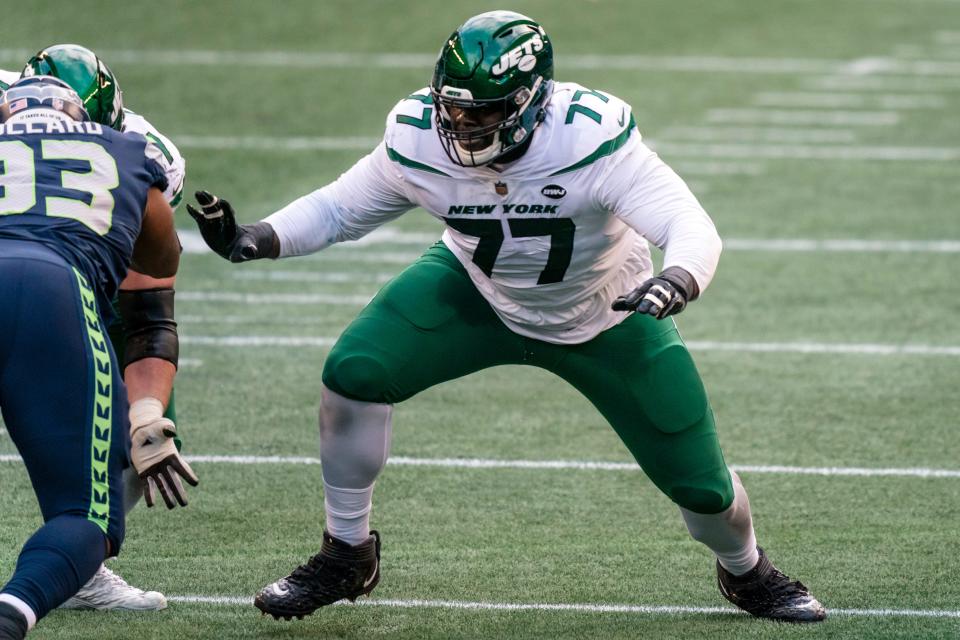 New York Jets offensive lineman Mekhi Becton blocks during the first half of an NFL football game against the Seattle Seahawks on Dec. 13, 2020, in Seattle.