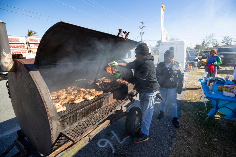 Sharon Sheffield Park, in Lynn Haven, hosted a Martin Luther King Festival Monday, January 17, 2022. Corinthian and Klarika Ross, with C Ross Barbecue, get their food ready at the festival with a plenty of steam.