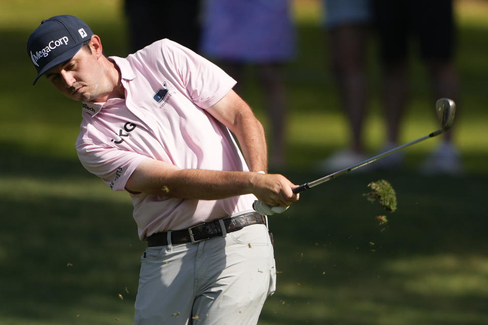 J.T. Poston hits from the fairway on the first hole during the first round of the RBC Heritage golf tournament, Thursday, April 18, 2024, in Hilton Head, S.C. (AP Photo/Chris Carlson)