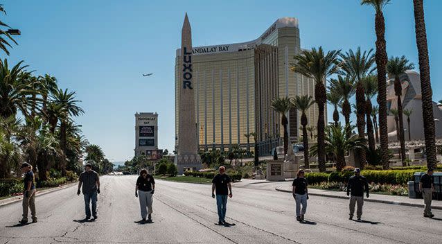 Members of the FBI sweep a stretch of South Las Vegas Boulevard, which is still closed to the public. Source: Nick Otto via ZUMA Wire via Yahoo US