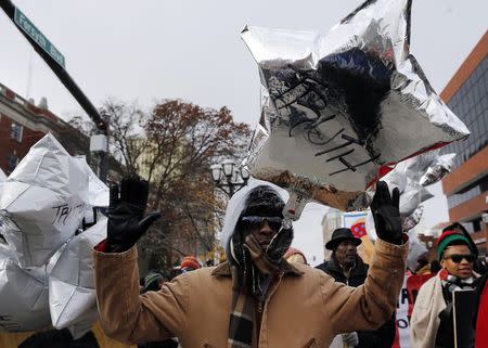 Demonstrators march through the streets during a protest over the shooting death of Michael Brown in Clayton, Missouri, November 17, 2014. REUTERS/Jim Young