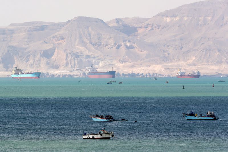 Ships are seen at the entrance of Suez Canal, which was blocked by stranded container ship Ever Given that ran aground