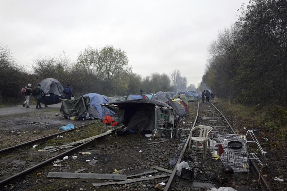 A migrants makeshift camp is set up in Calais, northern France, Saturday, Nov. 27, 2021. At the makeshift camps outside Calais, migrants are digging in, waiting for the chance to make a dash across the English Channel despite the news that at least 27 people died this week when their boat sank a few miles from the French coast. (AP Photo/Rafael Yaghobzadeh)