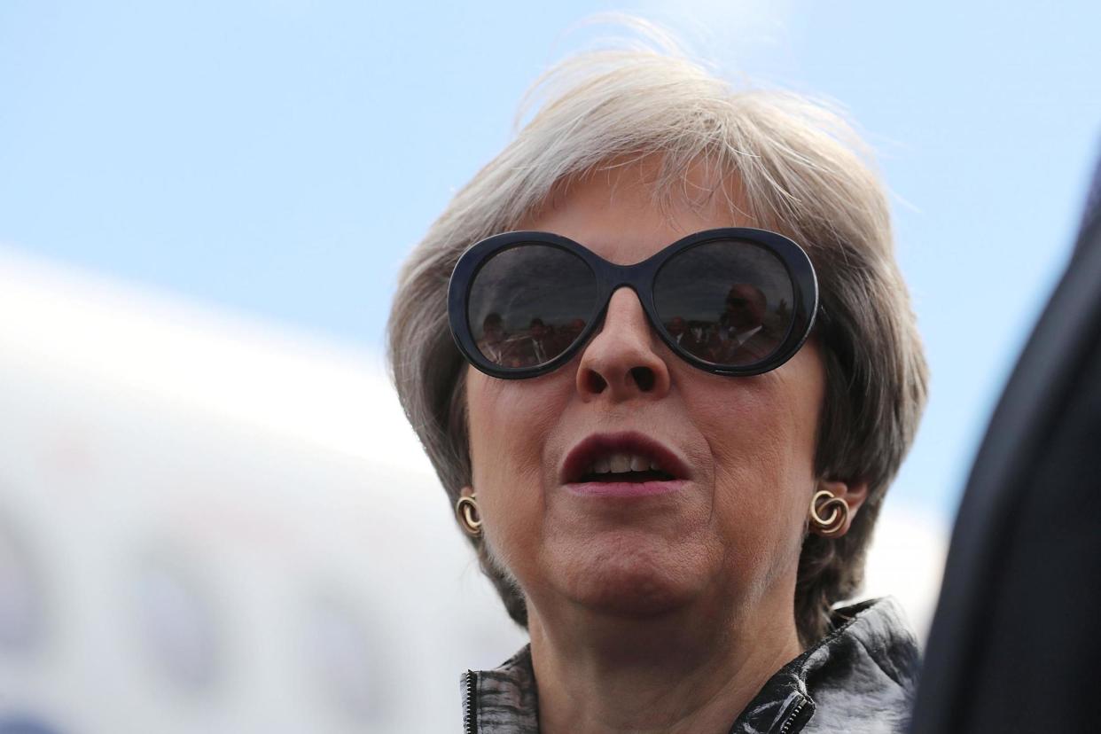 A motion has been tabled to bring forward summer recess for MPs. Theresa May pictured at Farnborough Airshow earlier: REUTERS