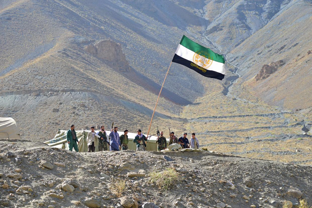 TOPSHOT - Afghan resistance movement and anti-Taliban uprising forces stand guard on a hilltop in the Astana area of Bazarak in Panjshir province on August 27, 2021, as among the pockets of resistance against the Taliban following their takeover of Afghanistan, the biggest is in the Panjshir Valley. (Photo by Ahmad SAHEL ARMAN / AFP) (Photo by AHMAD SAHEL ARMAN/AFP via Getty Images)