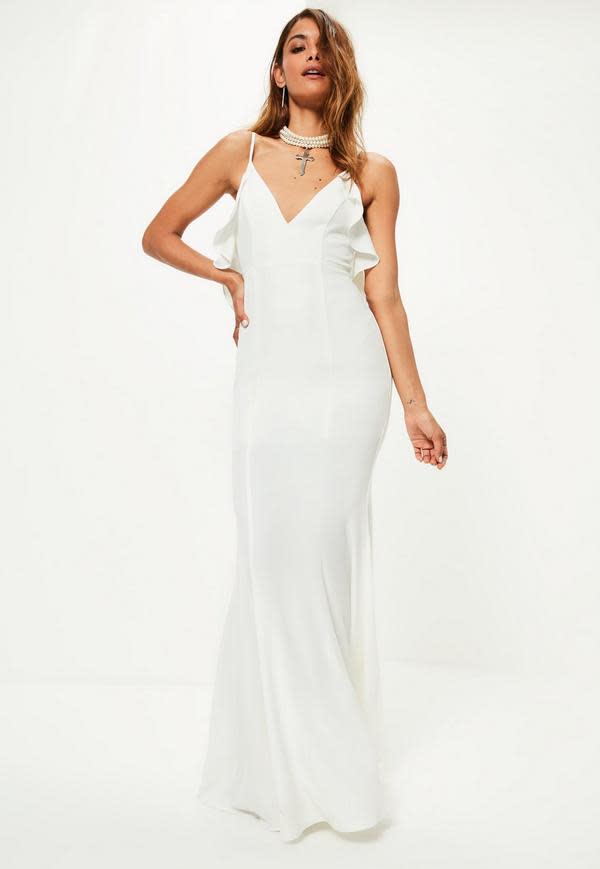 <p><a rel="nofollow noopener" href="https://www.missguided.co.uk/bridal-white-frill-detail-maxi-dress" target="_blank" data-ylk="slk:Missguided, £95;elm:context_link;itc:0;sec:content-canvas" class="link "><i>Missguided, £95</i></a> </p>