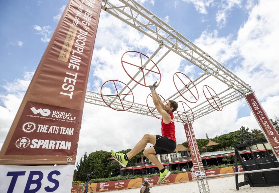 An athlete competes in the obstacle discipline of modern pentathlon during the new 5th discipline test in Ankara, Turkiye on June 28, 2022. 90 domestic and foreign athletes participated in the test race, held in Ankara for the first time in the world, hosted by the Turkish Modern Pentathlon Federation. The International Modern Pentathlon Union (UIPM), in cooperation with the World Disability Federation, tested the new branch 'obstacle discipline', which to be replaced with horse riding.