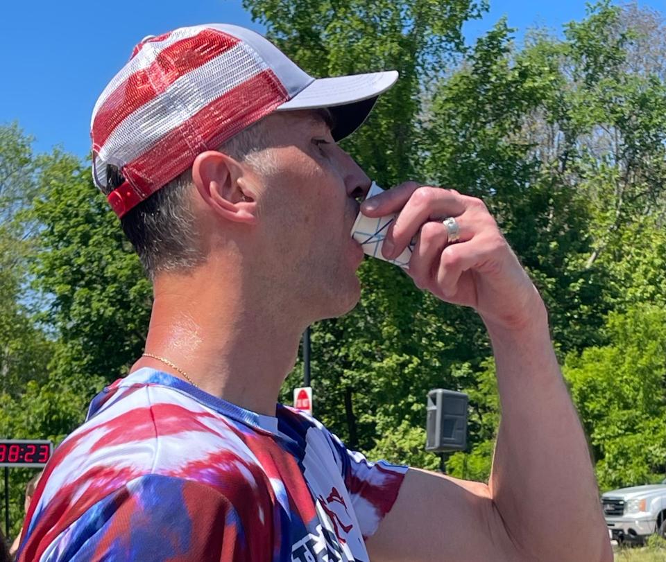 Former Boston Bruins captain Zdeno Chara takes a gulp of water after finishing Saturday's Dick Hoyt Memorial Yes You Can road race in Hopkinton.