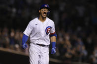 Chicago Cubs' Willson Contreras celebrates at third base after hitting a solo home run during the eighth inning of a baseball game against the Cincinnati Reds, Monday, July 26, 2021, in Chicago. (AP Photo/Paul Beaty)