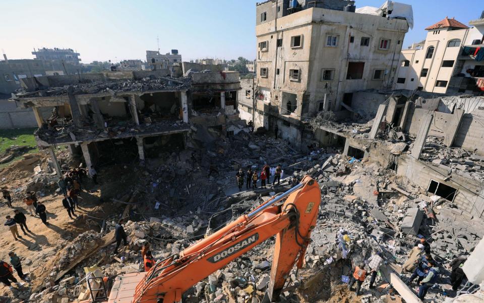 People conduct rescue work after an Israeli airstrike in the southern Gaza Strip city of Rafah