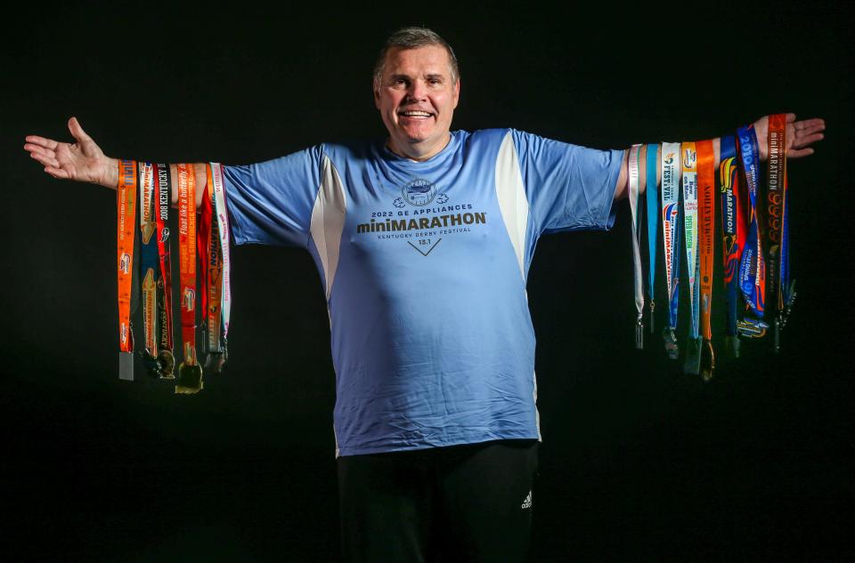 John Holland with some of his Derby Festival MiniMarathon medals. His first race was in 1974 when he was 15 years old.