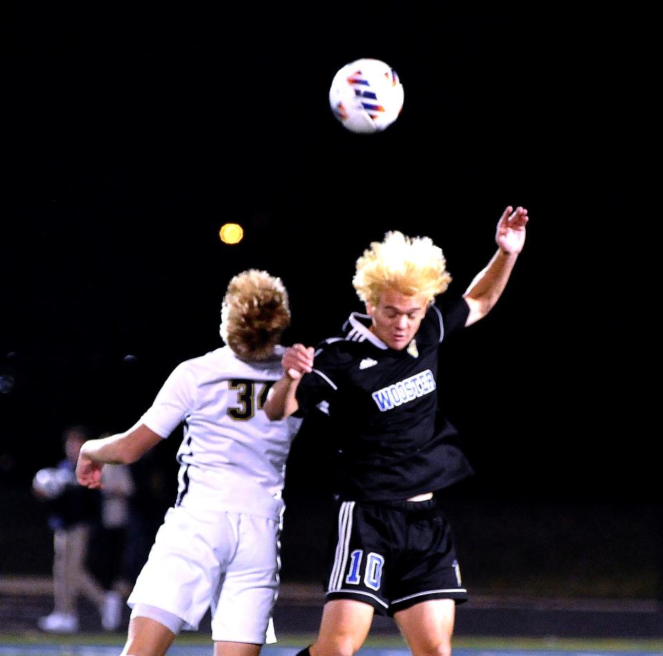 St. Ignatius' Ernie Vargo and Wooster's Brendan French battle on this header.