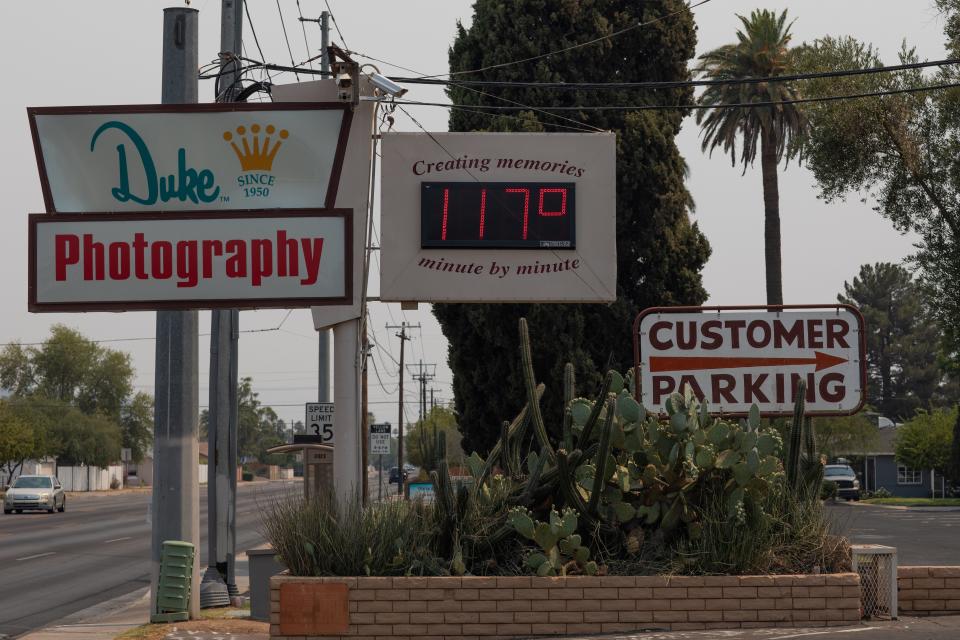 A thermometer sign displays a temperature of 117 degrees Fahrenheit on June 15, 2021 in Phoenix, Arizona.