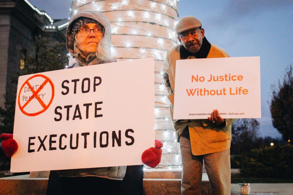 Demonstrators protest the execution of Kevin Johnson on Tuesday, Nov. 29, 2022 in downtown Columbia, Mo.