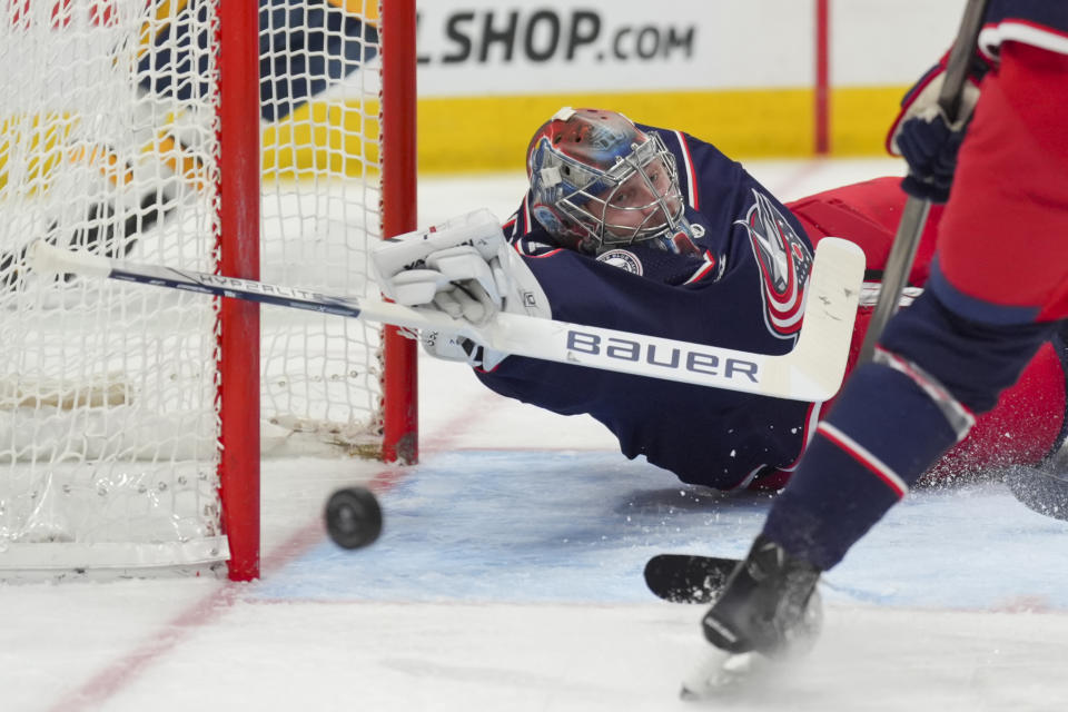 Columbus Blue Jackets goalie Daniil Tarasov reaches to make a save during the first period of an NHL hockey game against the Nashville Predators, Saturday, March 9, 2024, in Columbus, Ohio. (AP Photo/Aaron Doster)