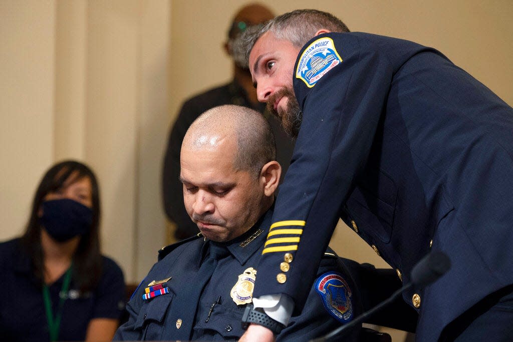 Washington Metropolitan Police Department officer Michael Fanone embraces U.S. Capitol Police Sgt. Aquilino Gonell before the House select committee hearing on the Jan. 6 attack on Capitol Hill in Washington, on July 27, 2021.