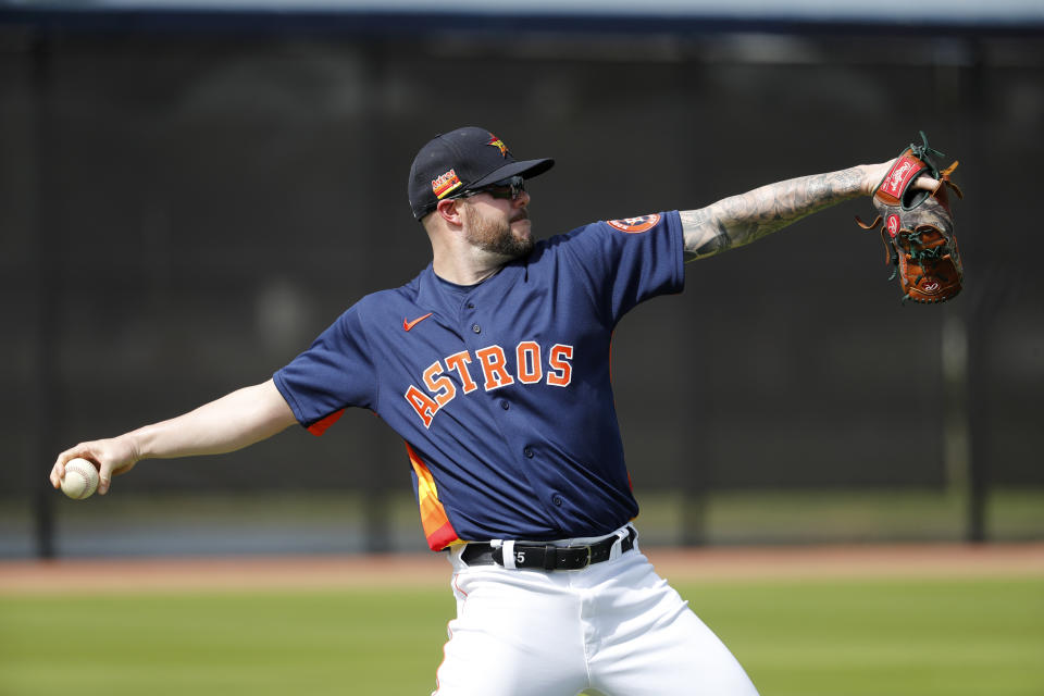 Houston Astros pitcher Ryan Pressly throws during spring training baseball practice Thursday, Feb. 13, 2020, in West Palm Beach, Fla. (AP Photo/Jeff Roberson)