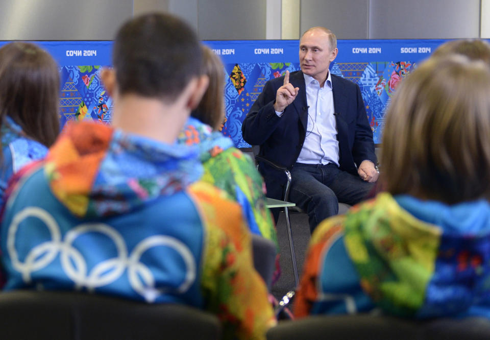 FILE - In this Friday, Jan. 17, 2014 file photo, Russian President Vladimir Putin speaks during a meeting with Olympic volunteers in the Black Sea resort of Sochi, Russia. Putin said gays should feel welcome at the upcoming Winter Olympic Games in Sochi, but they must "leave the children in peace." Putin told volunteers Friday that gays visiting Sochi "can feel calm and at ease," and vowed that there would be no discrimination at the games. But he emphasized that, according to a law banning homosexual "propaganda" among minors, gays cannot express their views on gay rights issues to anyone underage. (AP Photo/RIA-Novosti, Presidential Press Service, Alexei Nikolsky)