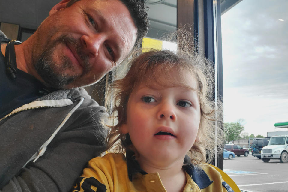 In this Saturday, Aug. 24, 2019 photo provided by George Hendrickson, George takes a selfie photo with his 7-year-old son, Eliyah, at a Sioux Falls, S.D. restaurant. Eliyah has been diagnosed with Dravet syndrome and his father would like to see the state approve medical marijuana to aid in his treatment. Volunteers are gathering signatures to get an initiated measure on the November ballot. (Photo by George Hendrickson)