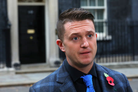 FILE PHOTO: Far right activist Stephen Yaxley-Lennon, who goes by the name Tommy Robinson, speaks outside 10 Downing Street after handing in a petition on behalf of a serving soldier who was disciplined for posing for a selfie with him, in London, Britain, November 6, 2018. REUTERS/Simon Dawson