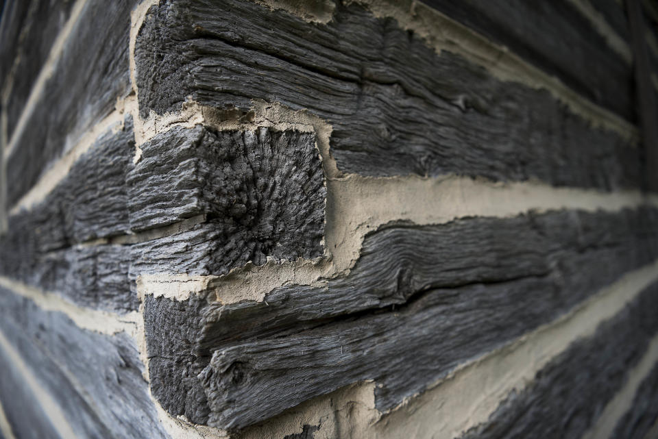 A detail of weathered wood on corner of a barn on The William Faulkner House&nbsp;property.