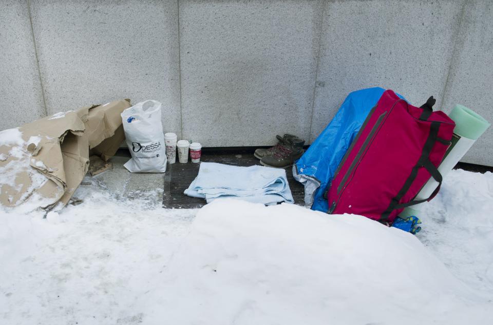 A homeless person’s belongings are shown on a heated vent on a street in Montreal THE CANADIAN PRESS IMAGES/Graham Hughes